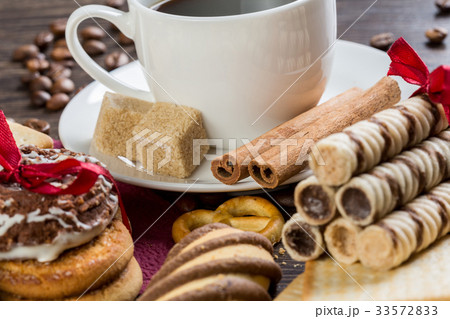 Biscuits and coffee on table Biscuits and coffee on table 33572833