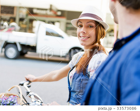 Beautiful woman riding on bike 33573086