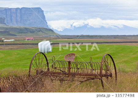 Rusty plows on a field of Iceland 33577498