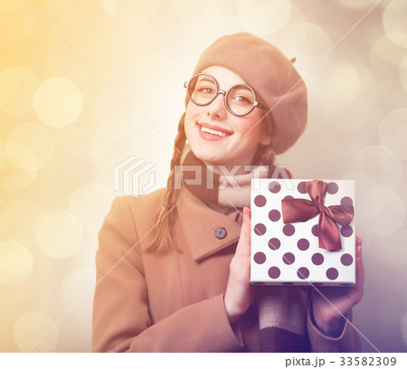 Redhead girl with gift box Redhead girl with gift box 33582309