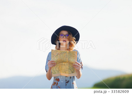 young woman in dress with map young woman in dress with map 33582609