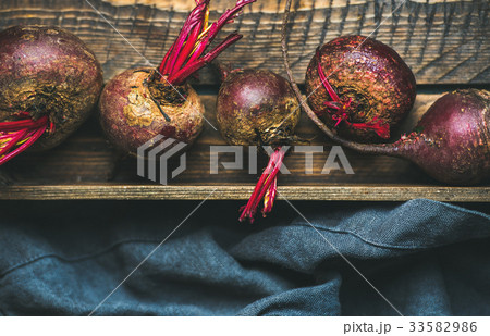 Raw organic purple beetroots in wooden box Raw organic purple beetroots in wooden box 33582986