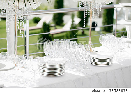 Detail of a table dish with glasses at an event on 33583833