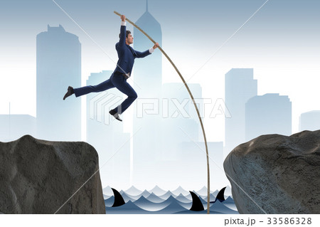 Businessman in pole vaulting concept 33586328