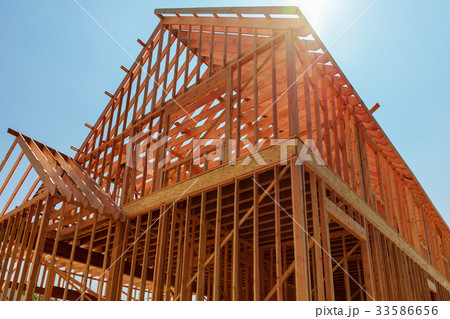 The house has been framed and covered in plywood. 33586656