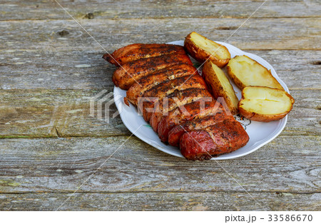 Barbecue pork steak slices on white plate Barbecue pork steak slices on white plate 33586670