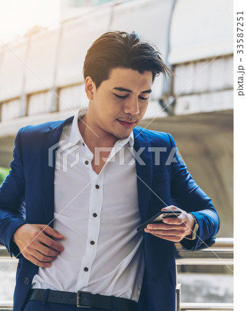 Business man using smartphone Business man using smartphone 33587251
