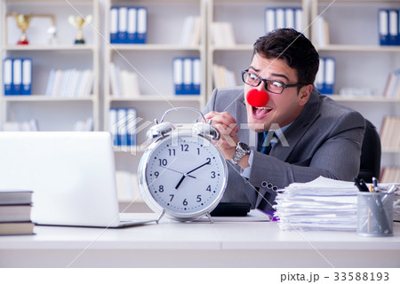 Clown businessman with alarm clock missing 33588193