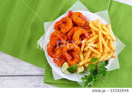 tasty breaded Fried Shrimps and french fries tasty breaded Fried Shrimps and french fries 33592648