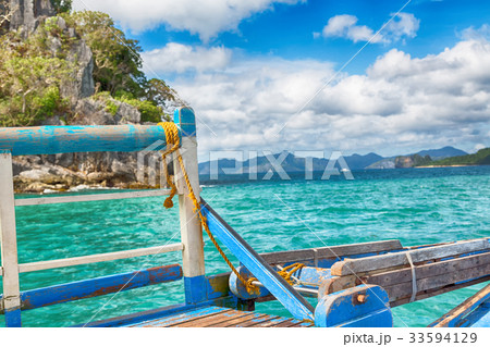 view of the island hill from the prow of a boat 33594129