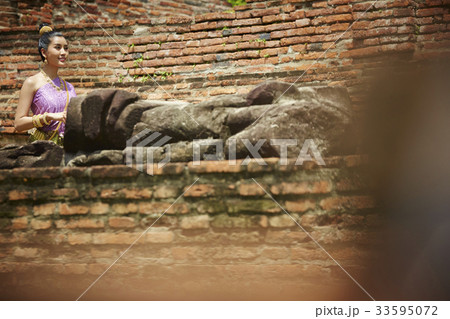 young woman in that costume is walking in old temple young woman in that costume is walking in old temple 33595072