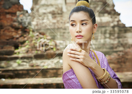 beautiful thai woman is hugging herself at ayutthaya beautiful thai woman is hugging herself at ayutthaya 33595078