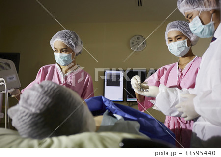surgeons are doing an operation at hospital surgeons are doing an operation at hospital 33595440