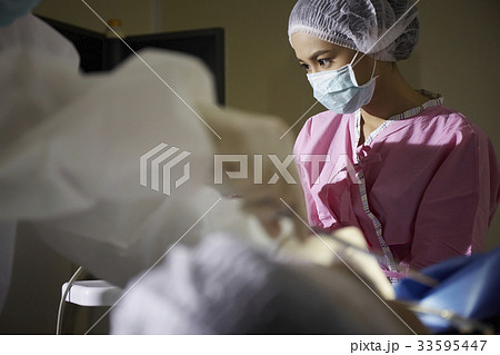 a portrait of surgeon standing, looking and thinking a portrait of surgeon standing, looking and thinking 33595447