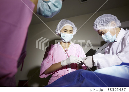 The doctor and nurses are preparing for the surgery The doctor and nurses are preparing for the surgery 33595487