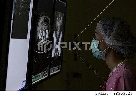 The portrait of nurse looking at mri The portrait of nurse looking at mri 33595529