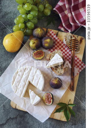 Goat cheese, figs, fruits and bread Goat cheese, figs, fruits and bread 33596539