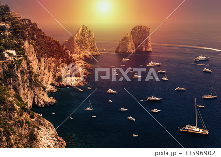 Faraglioni, Capri island, in sunrise light 33596902