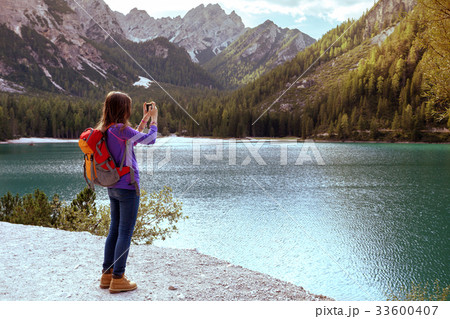 tourist girl at the Braies lake 33600407