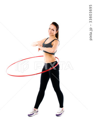 Woman training with hula hoop isolated on white 33603695