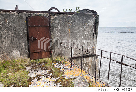 Rusted steel door, entrance to abandoned bunker Rusted steel door, entrance to abandoned bunker 33604102