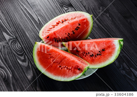 Background of fresh ripe watermelon slices Background of fresh ripe watermelon slices 33604386