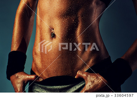 Sexy woman abdominal muscles Sexy woman abdominal muscles 33604597