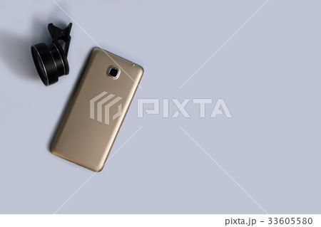 Clip lens with mobile phones in white background. 33605580