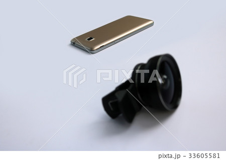 Clip lens with mobile phones in white background. 33605581
