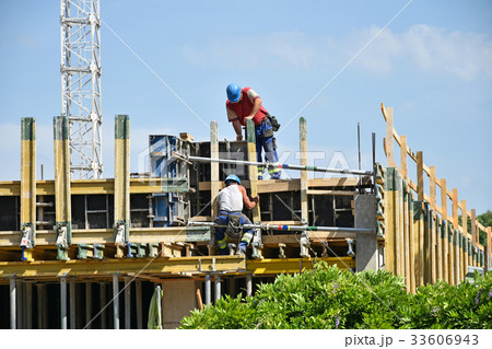 Construction workers at work 33606943