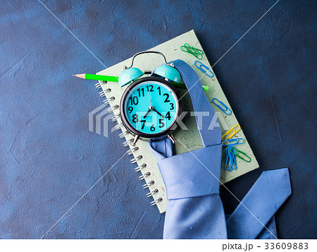 Alarm clock and businessman's accessories 33609883