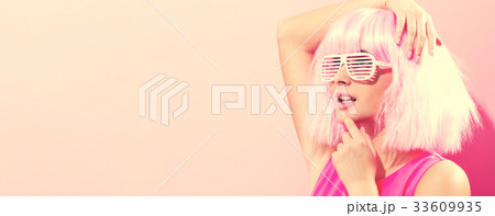 Beautiful woman in a bright pink wig 33609935