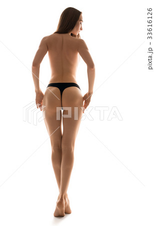 Rearview shot of woman posing in black tanga Rearview shot of woman posing in black tanga 33616126