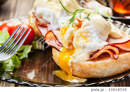 Eggs Benedict on toasted muffins with ham 33618550