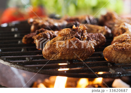 Grilling chicken wings on barbecue grill Grilling chicken wings on barbecue grill 33620687