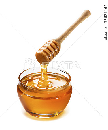 Honey pot and dipper high above isolated on white 33621165