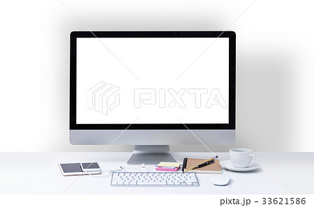 Office desk with computer screen, keyboard, mouse 33621586