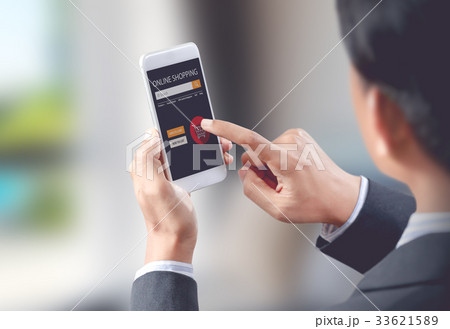 Businessman shop online on mobile with shopping ca 33621589