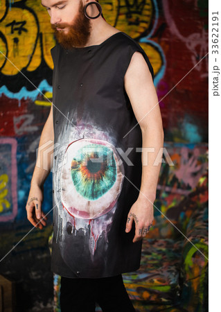 A creative, unusual red-haired man in designer 33622191