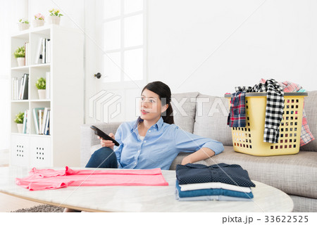 pretty housewife folding family messy clothing 33622525