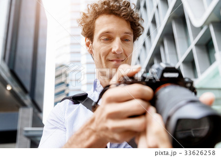 Male photographer taking picture Male photographer taking picture 33626258