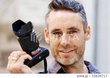 Male photographer taking picture Male photographer taking picture 33626717