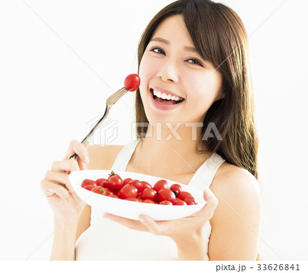 beautiful Young Woman Eating Tomatoes beautiful Young Woman Eating Tomatoes 33626841