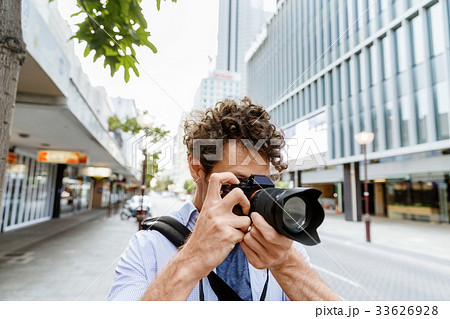 Male photographer taking picture Male photographer taking picture 33626928