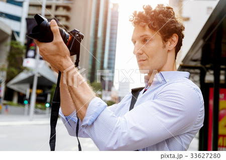 Male photographer taking picture 33627280