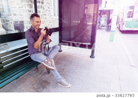 Male photographer taking picture Male photographer taking picture 33627765
