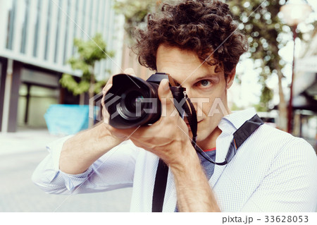 Male photographer taking picture Male photographer taking picture 33628053