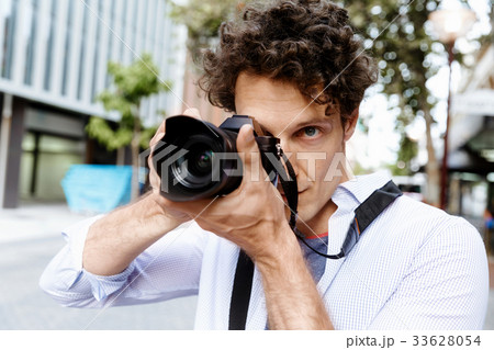 Male photographer taking picture Male photographer taking picture 33628054