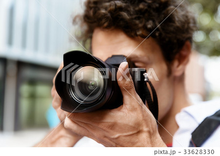Male photographer taking picture Male photographer taking picture 33628330