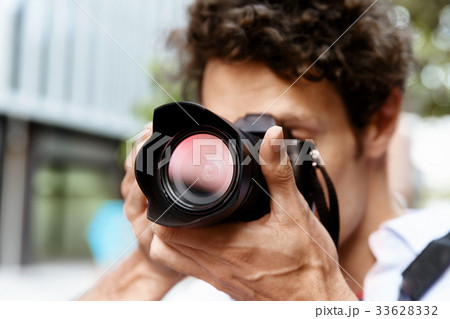 Male photographer taking picture Male photographer taking picture 33628332